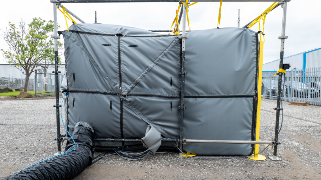 2m x 2m x 2m Pressurised Welding Enclosure (PWE) external photo in industrial site showing cable and ducting entry